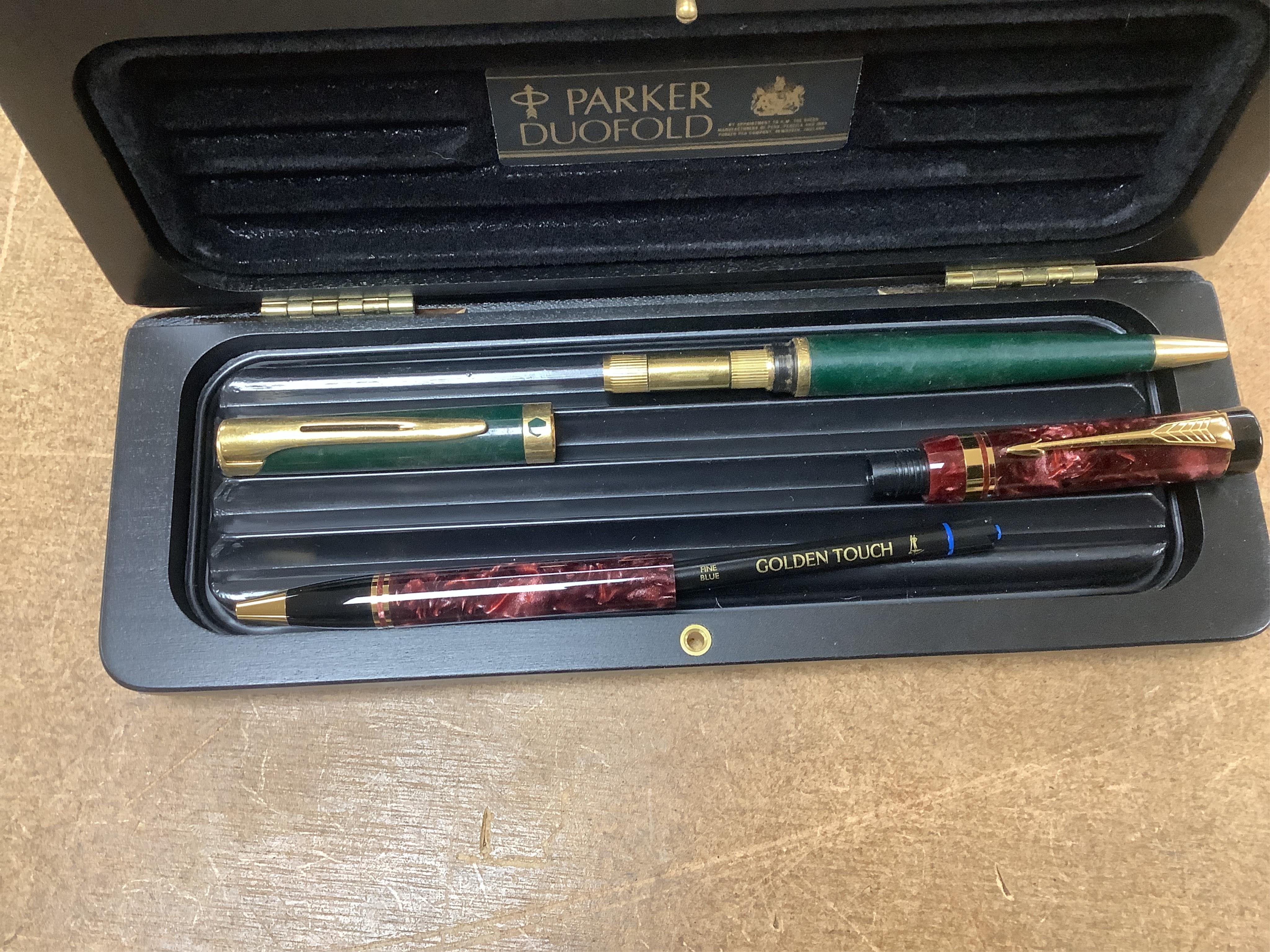 A quantity of various pens to include Parker Duofold and two Parker pen cases. Condition - varies